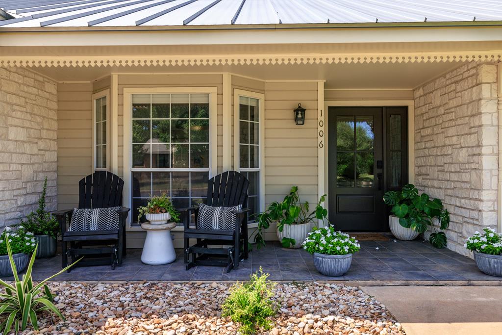 a view of a chair and table in a patio