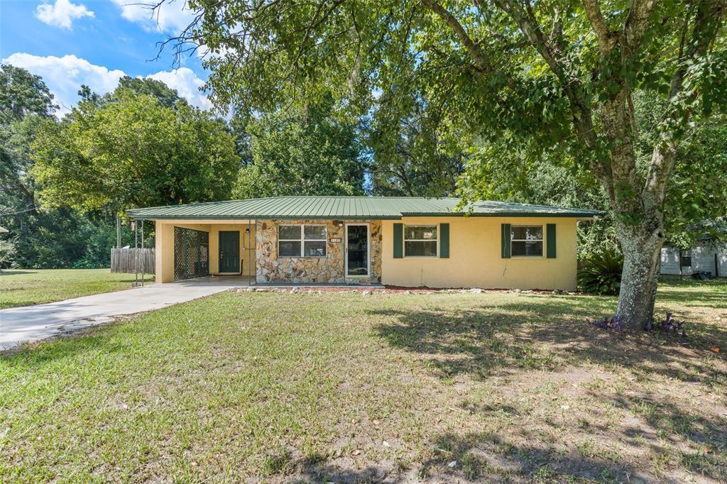 front view of a house with a yard