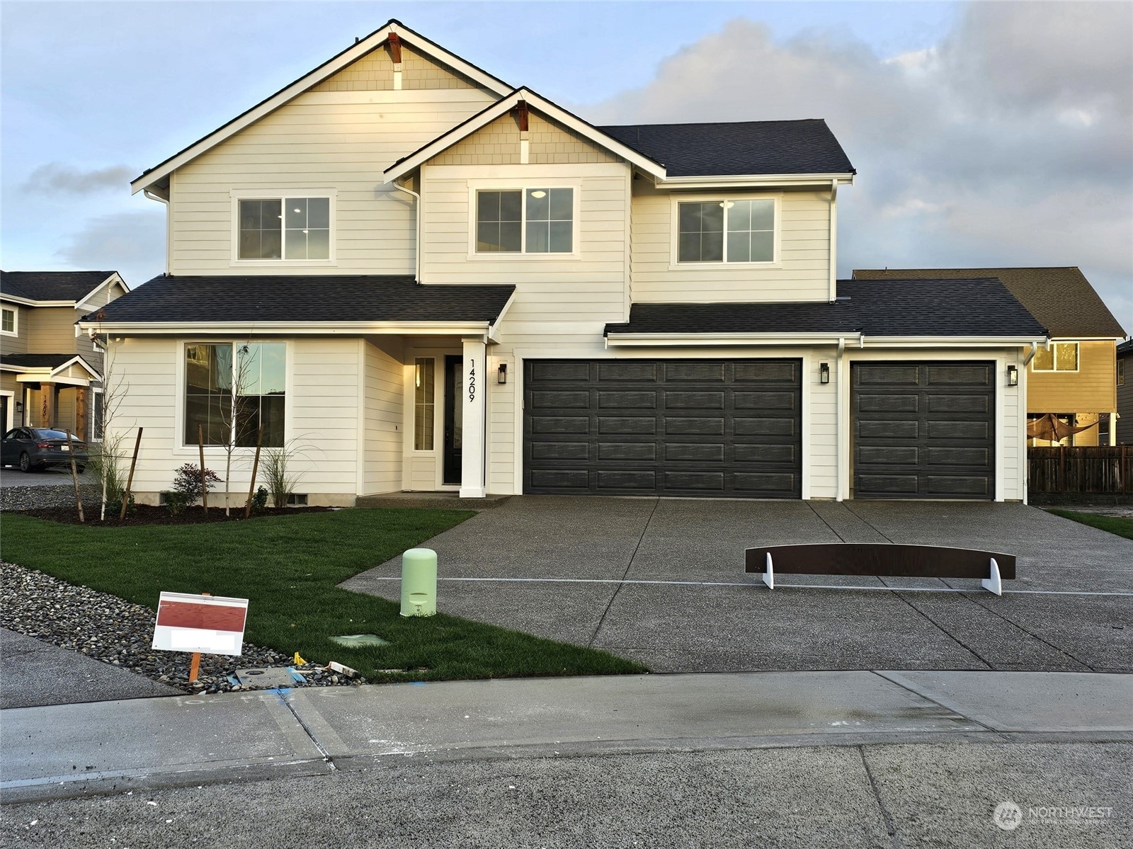 a front view of a house with a yard