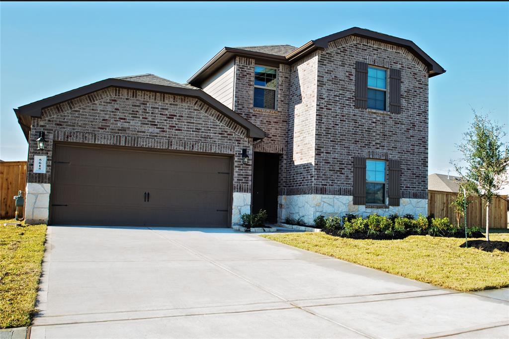 a front view of a house with yard