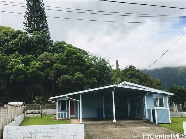 a house with trees in the background