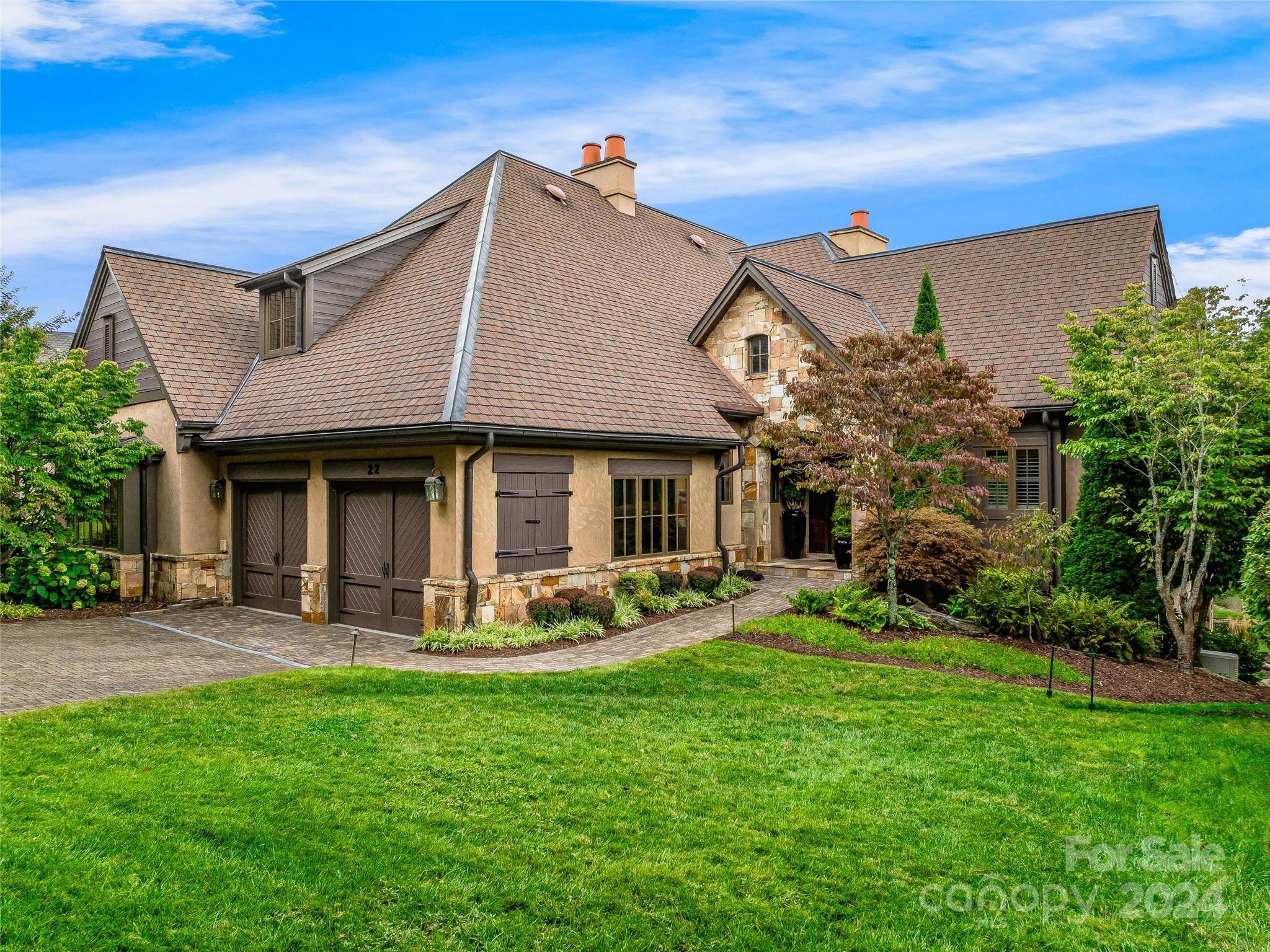 a front view of a house with garden