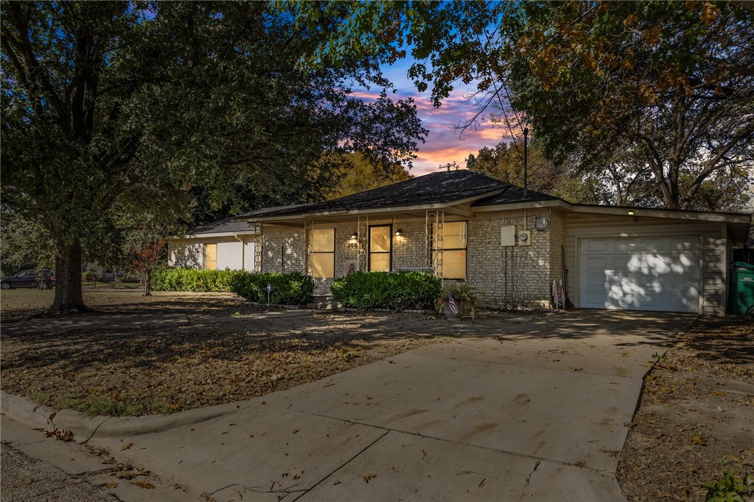 a front view of a house with yard