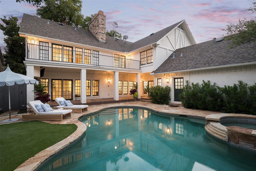 a swimming pool view with a outdoor seating