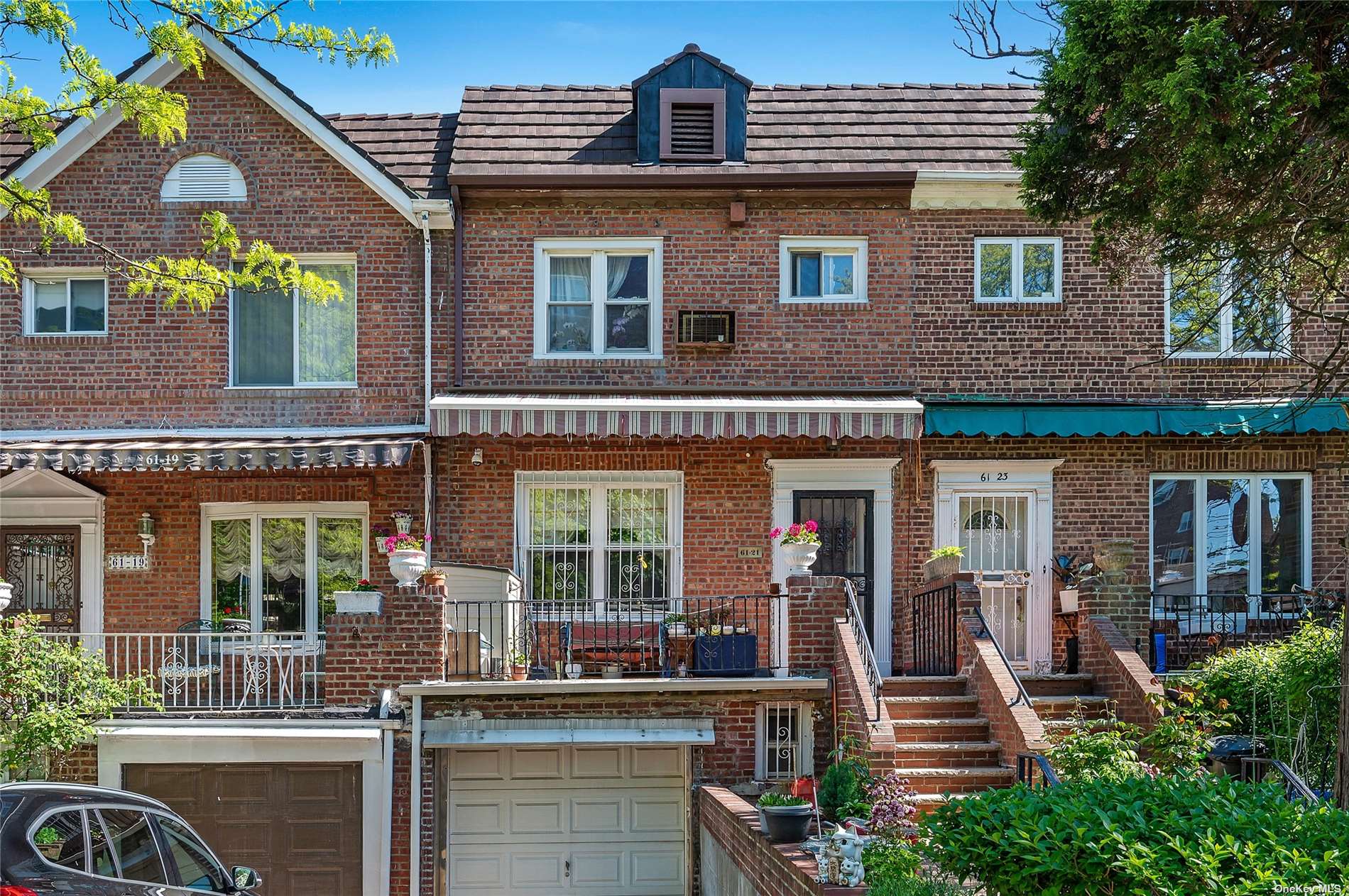 a front view of multiple houses with outdoor seating