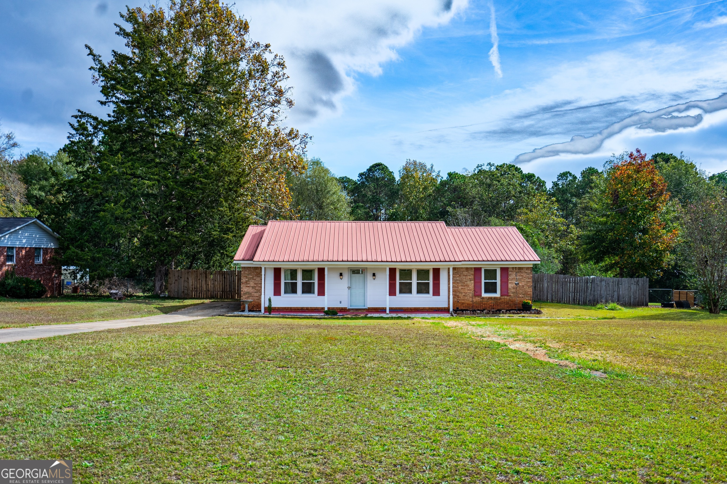 a view of a house with a big yard