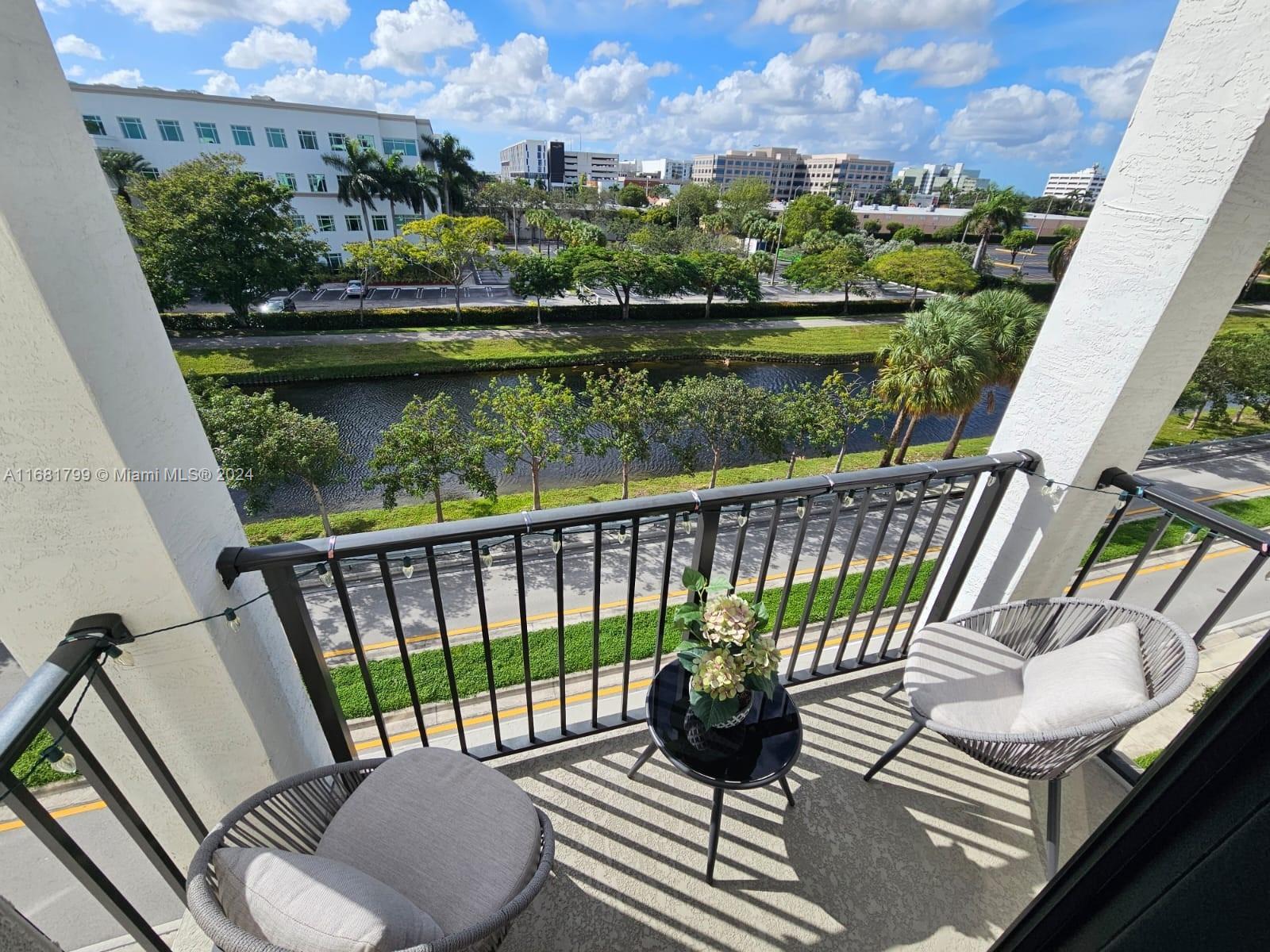 a view of balcony with furniture