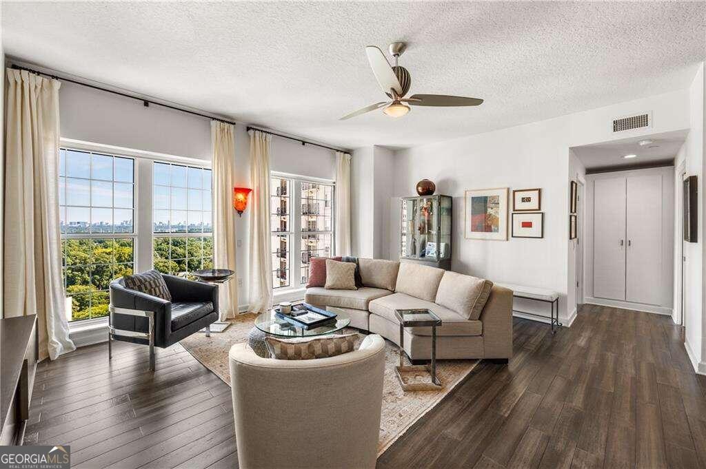 a living room with furniture and a large window