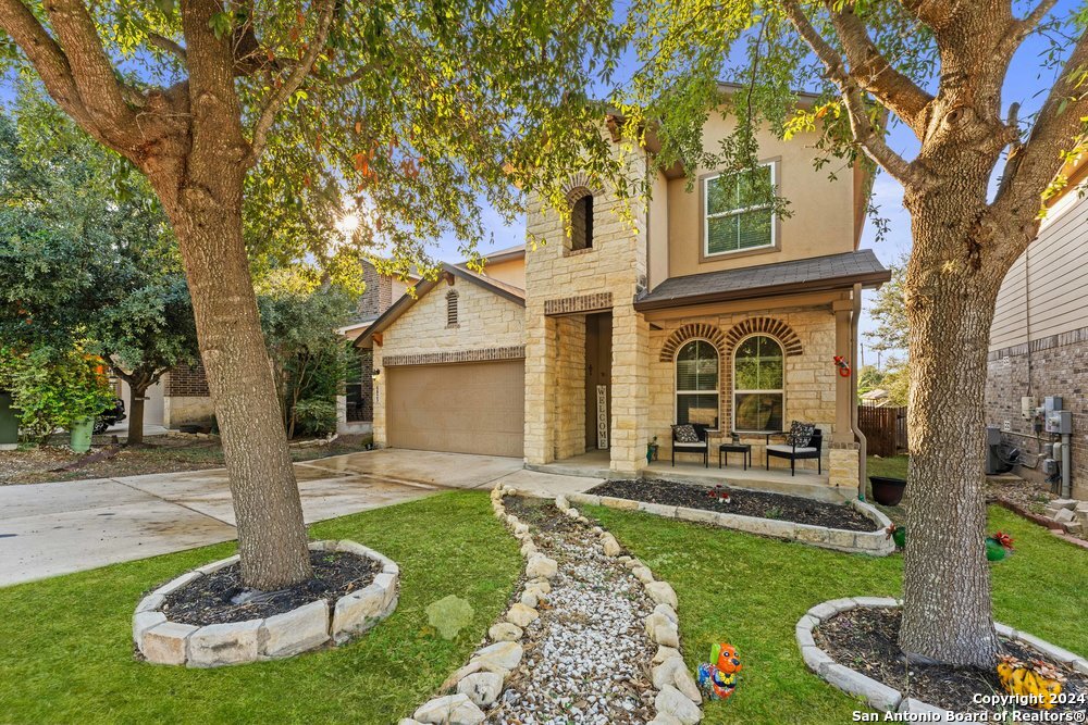 a front view of a house with a yard