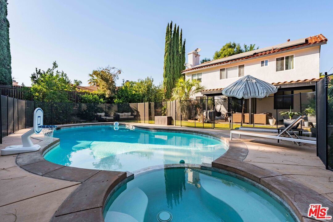 a view of a swimming pool with a patio