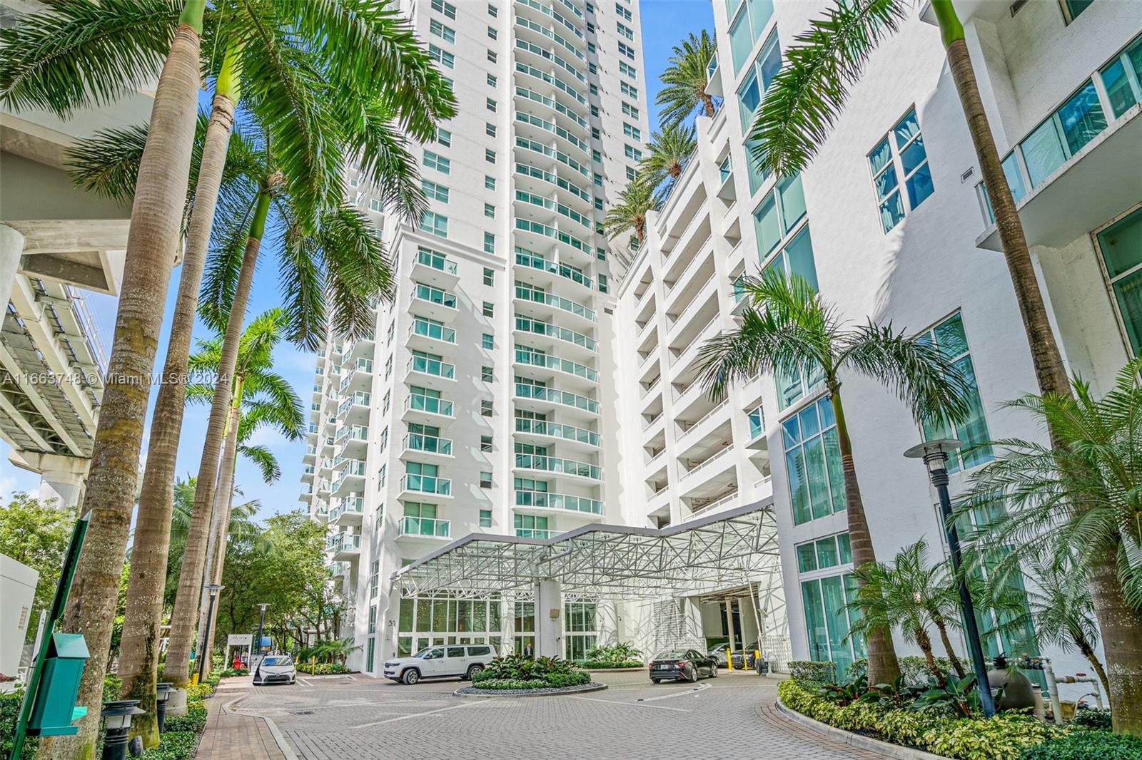 a view of a palm plants in front of a building