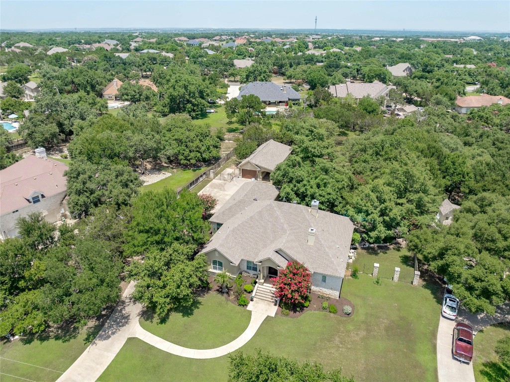 an aerial view of a house with yard