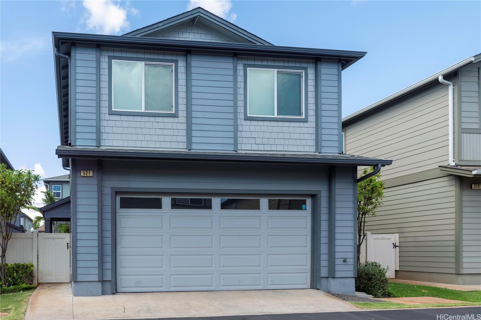 a front view of a house with a garage