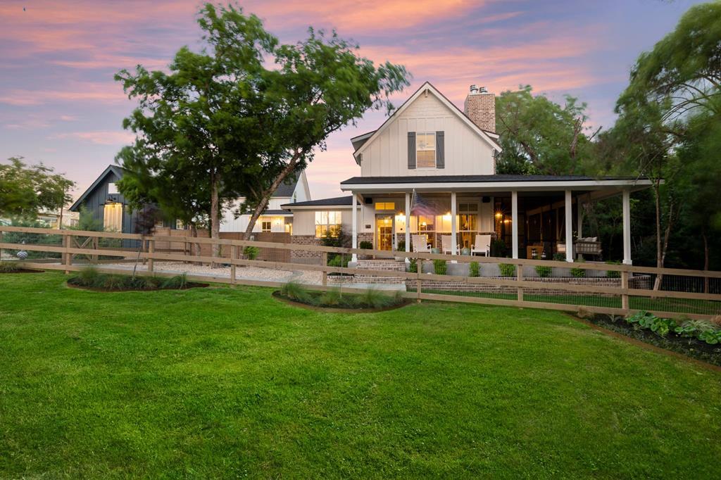 a front view of a house with a yard table and chairs