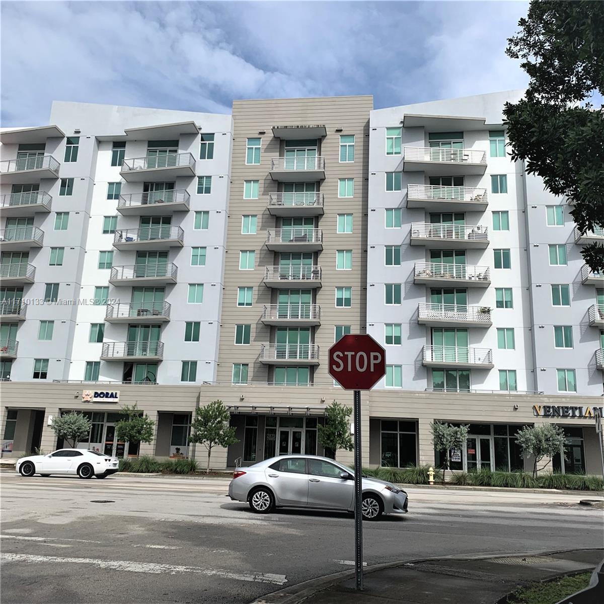 a front view of a building with street view and building