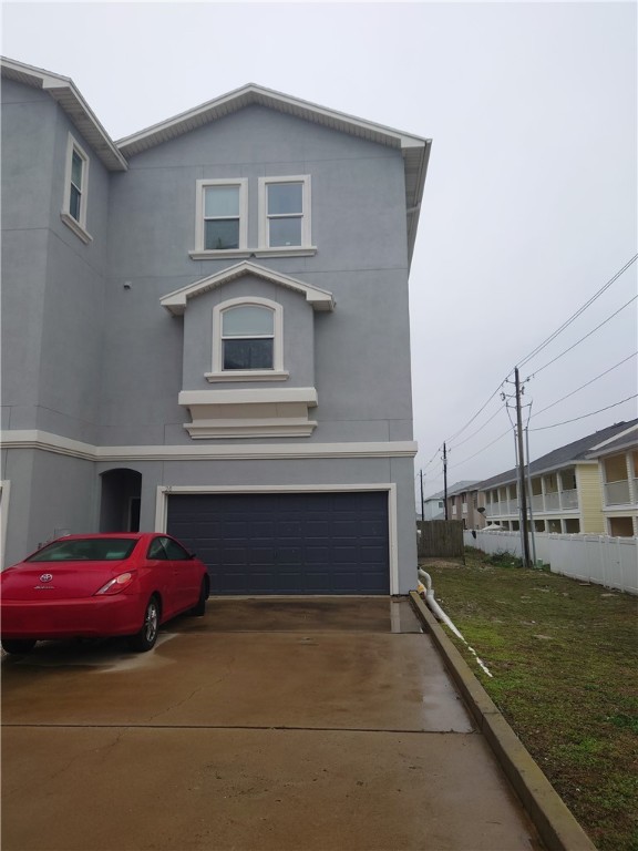 a front view of a house with parking space