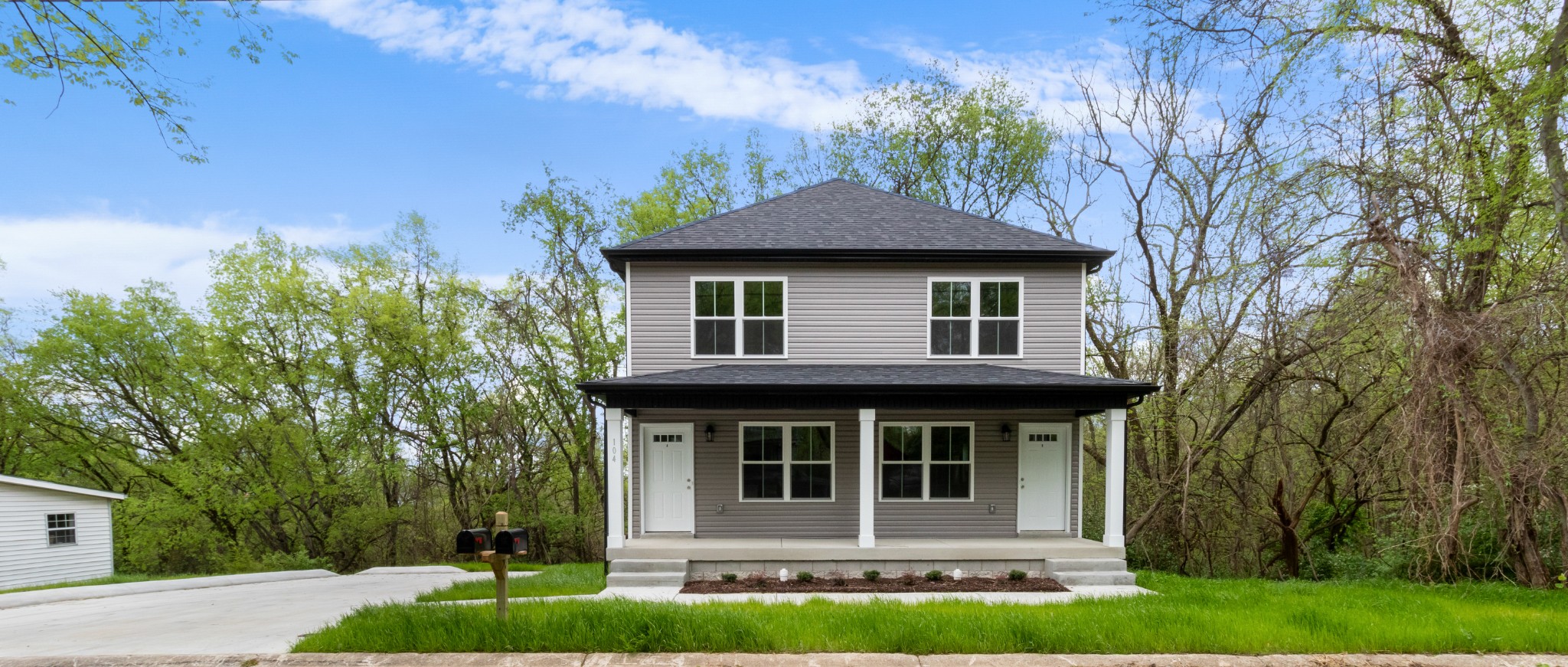 a front view of a house with a yard