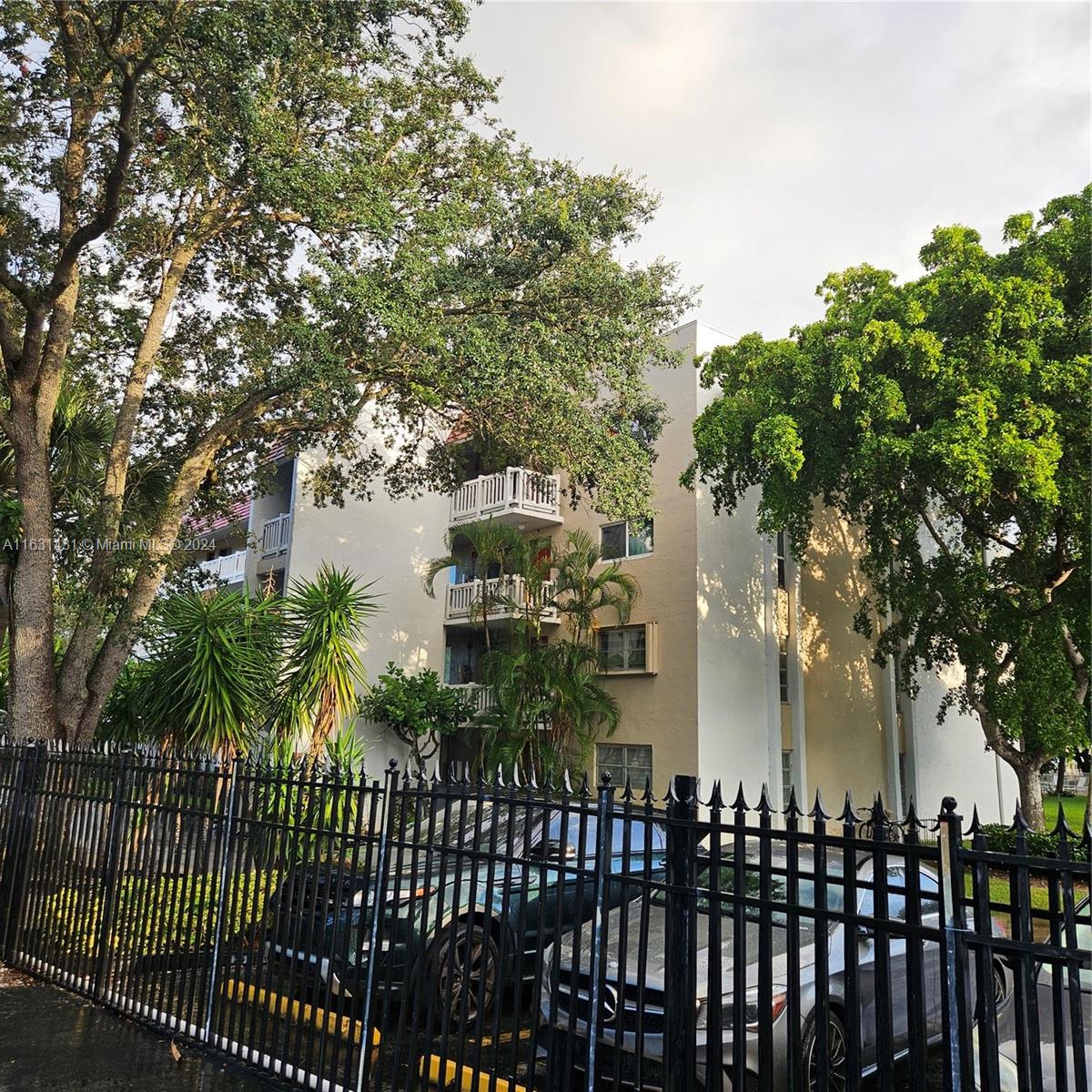 a couple of cars parked in front of house