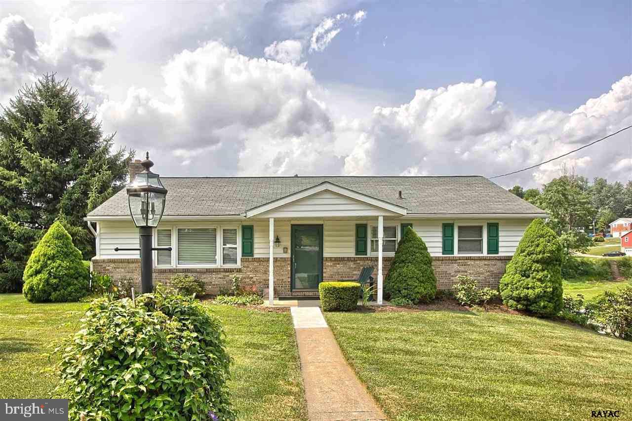 front view of a house with a yard