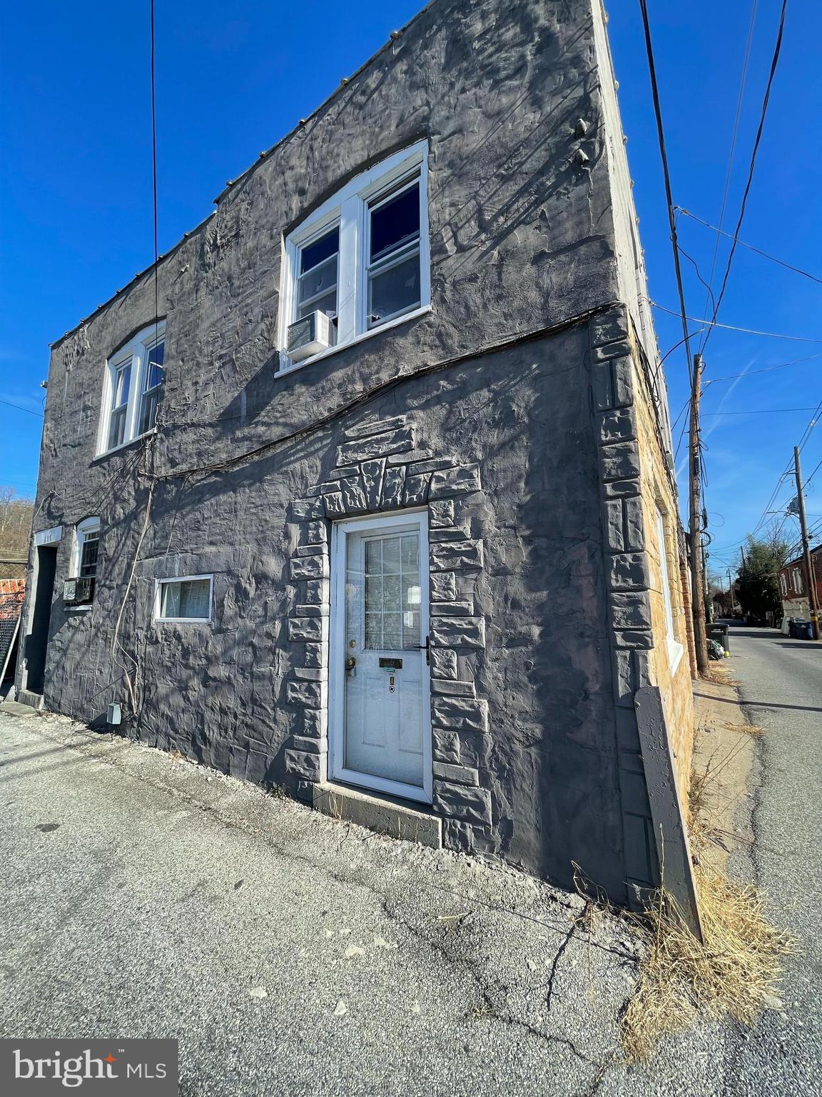 a brick building with a door and a door