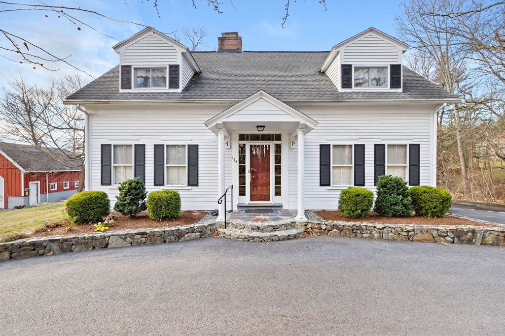 front view of a house with a small yard