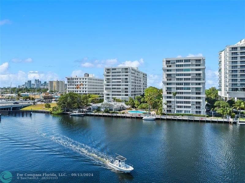 a view of a lake with tall buildings