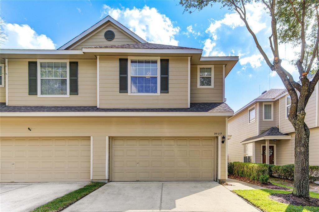 a front view of a house with a garage