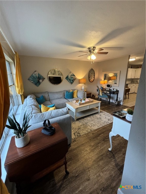 a living room with furniture and a clock