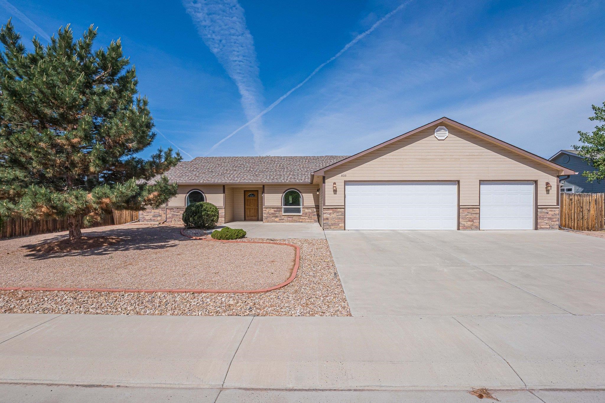 front view of a house with a yard