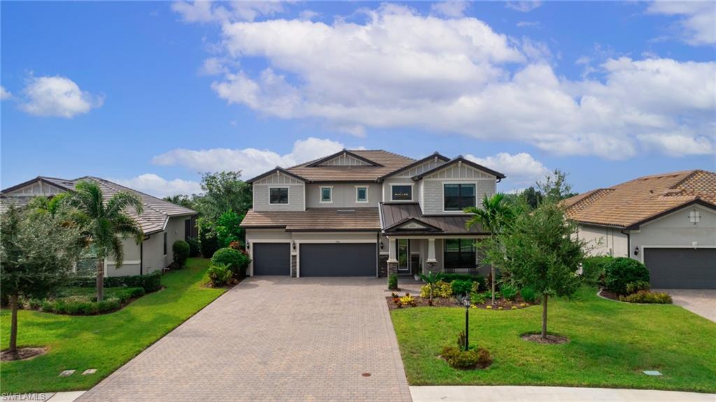 a aerial view of a house with yard and green space