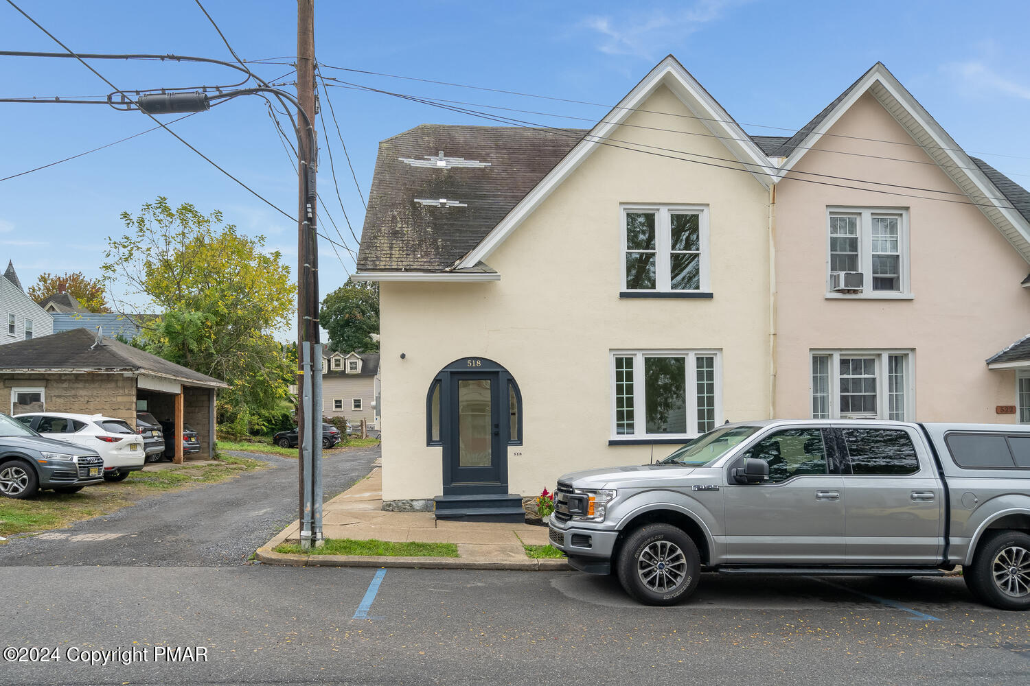 a view of a car parked in front of a house