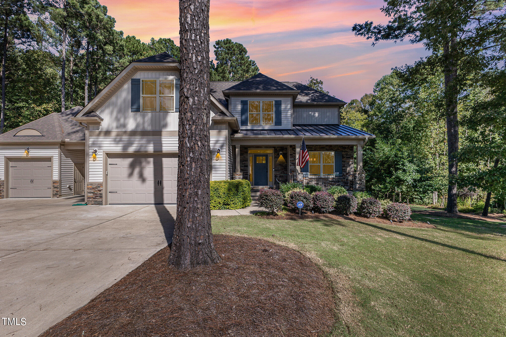 a view of a house with backyard porch and sitting area