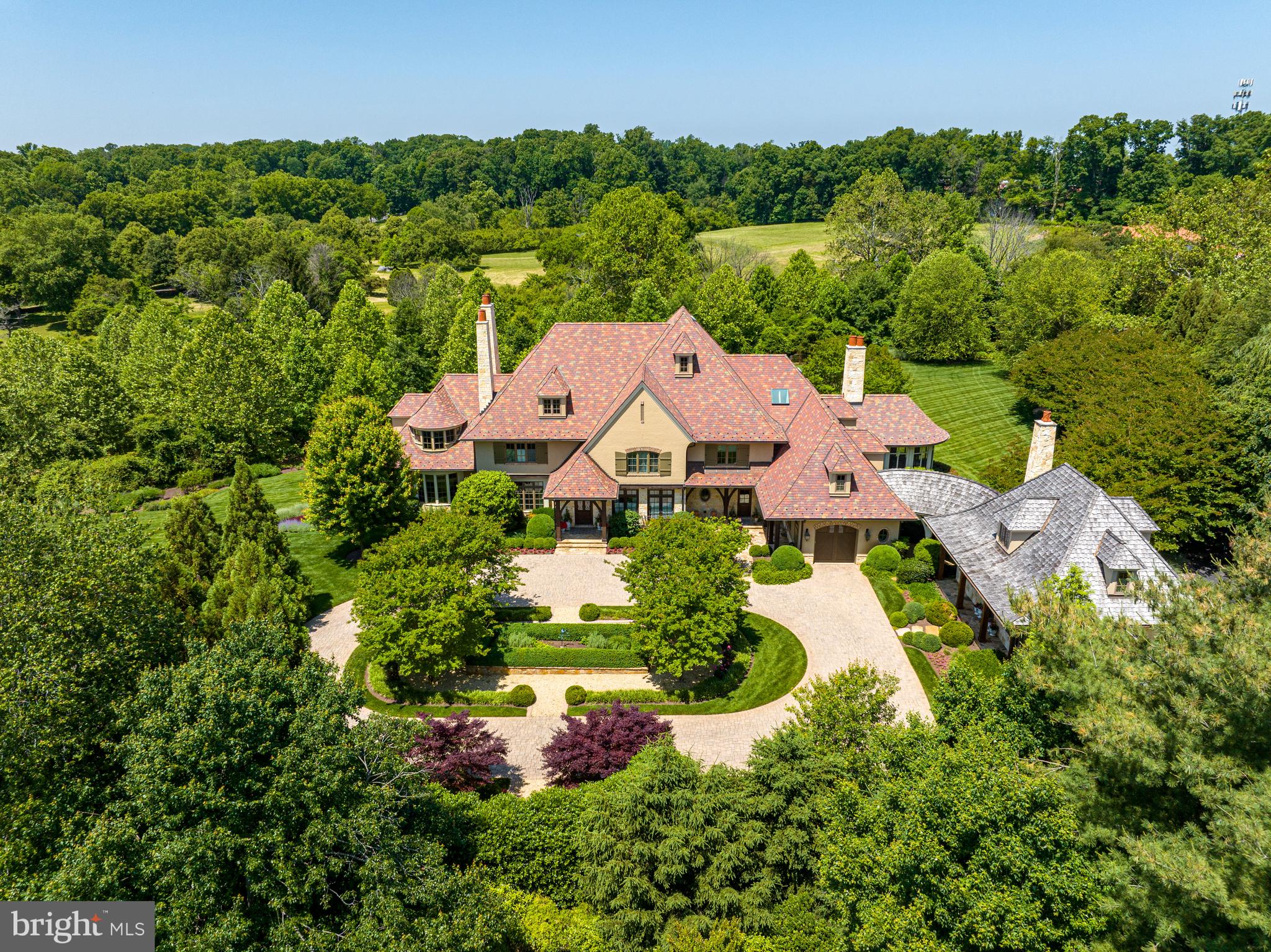 an aerial view of a house with outdoor space and street view