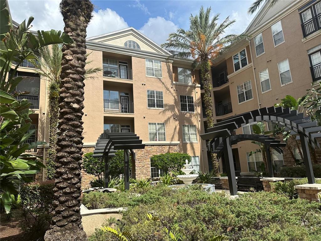 a front view of a residential apartment building with a yard