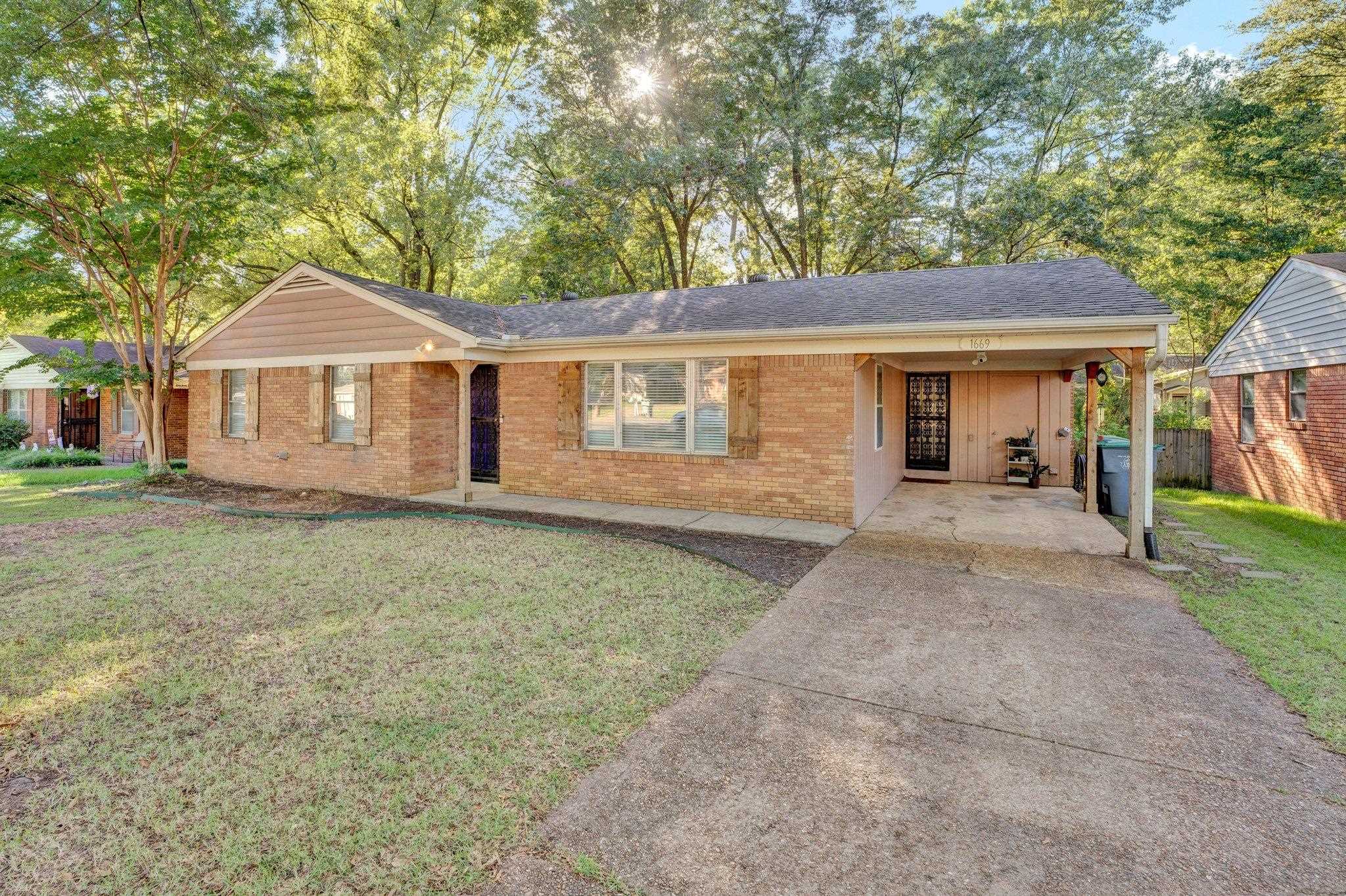 front view of a house with a yard