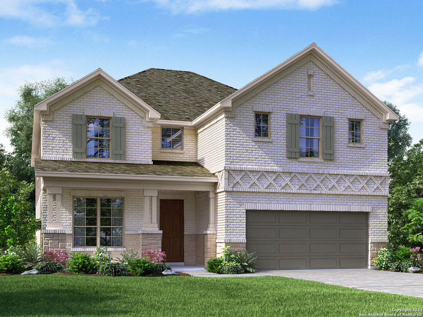 a front view of a house with a yard and garage