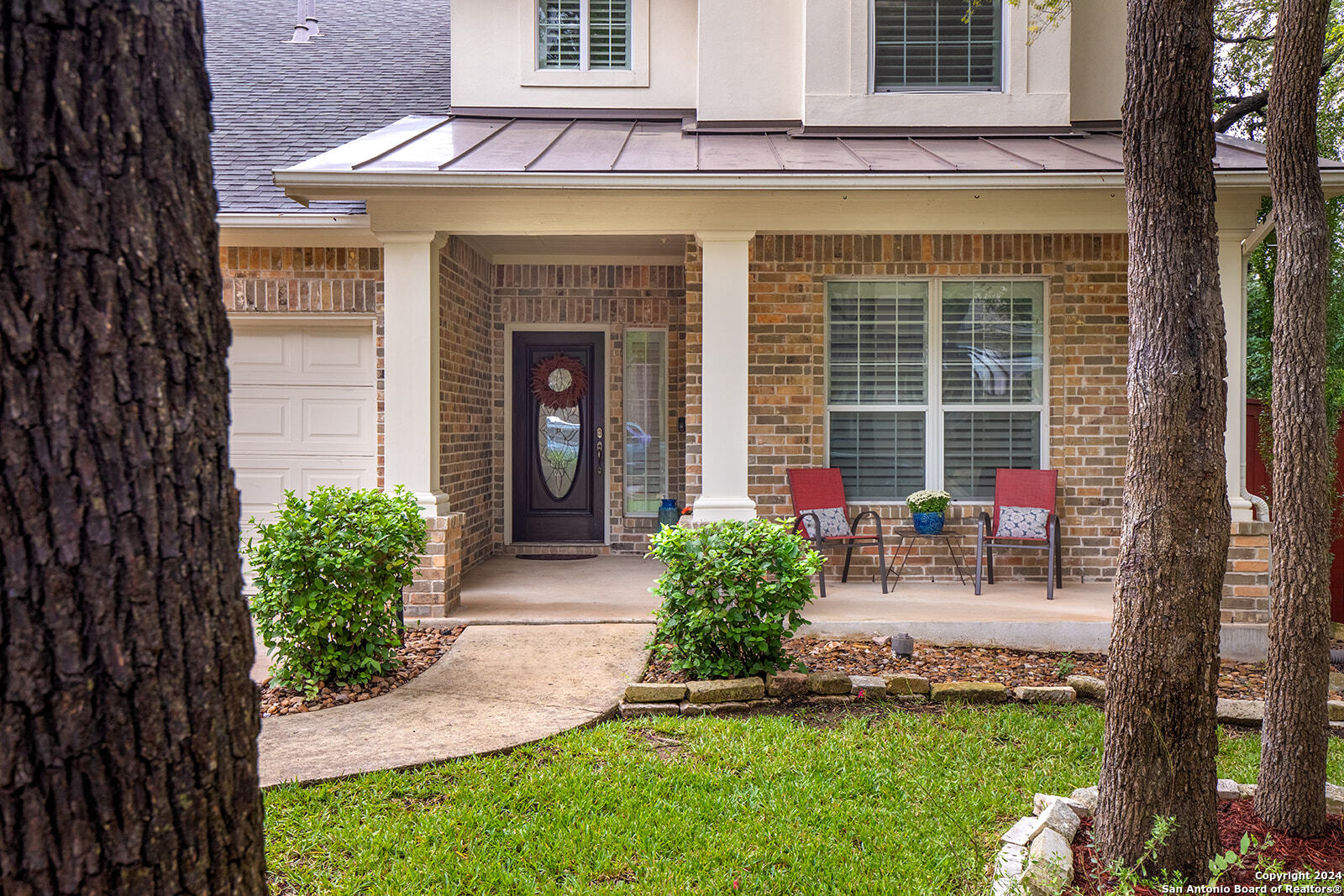 a front view of a house with a yard