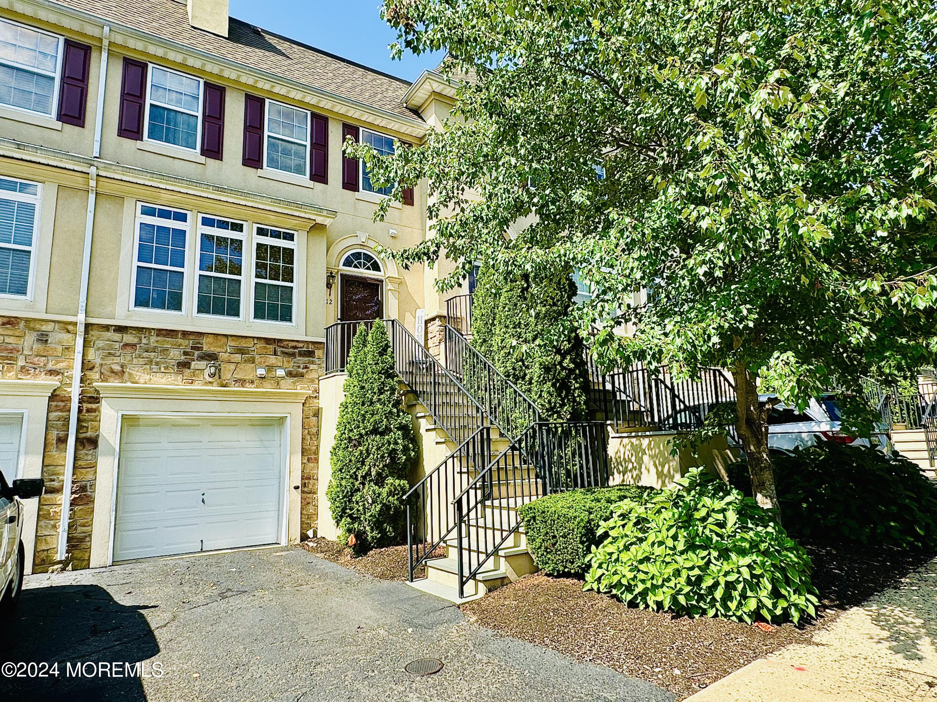 a view of a house with a tree