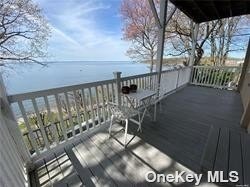 a view of balcony with wooden floor