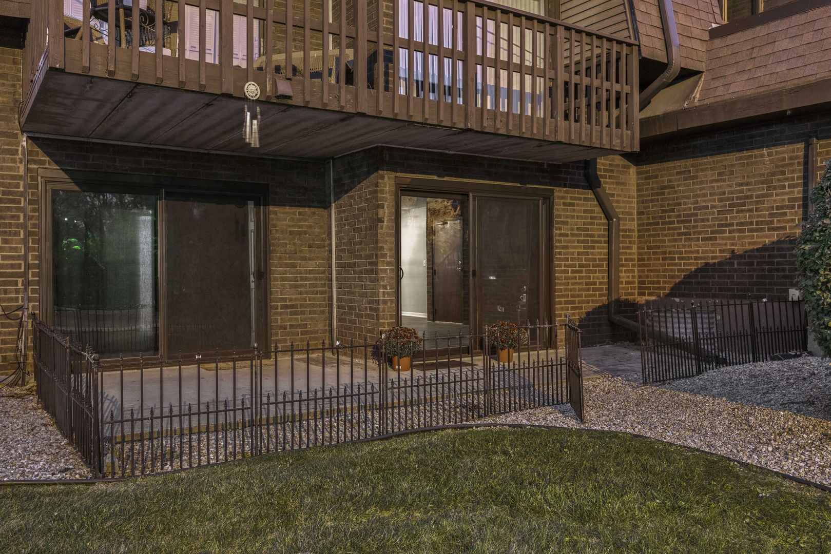 a view of a house with a wooden fence