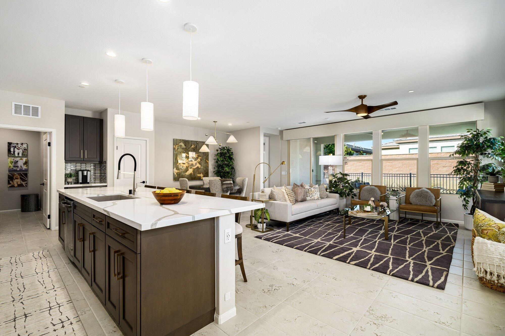 a kitchen with sink stove and outdoor view