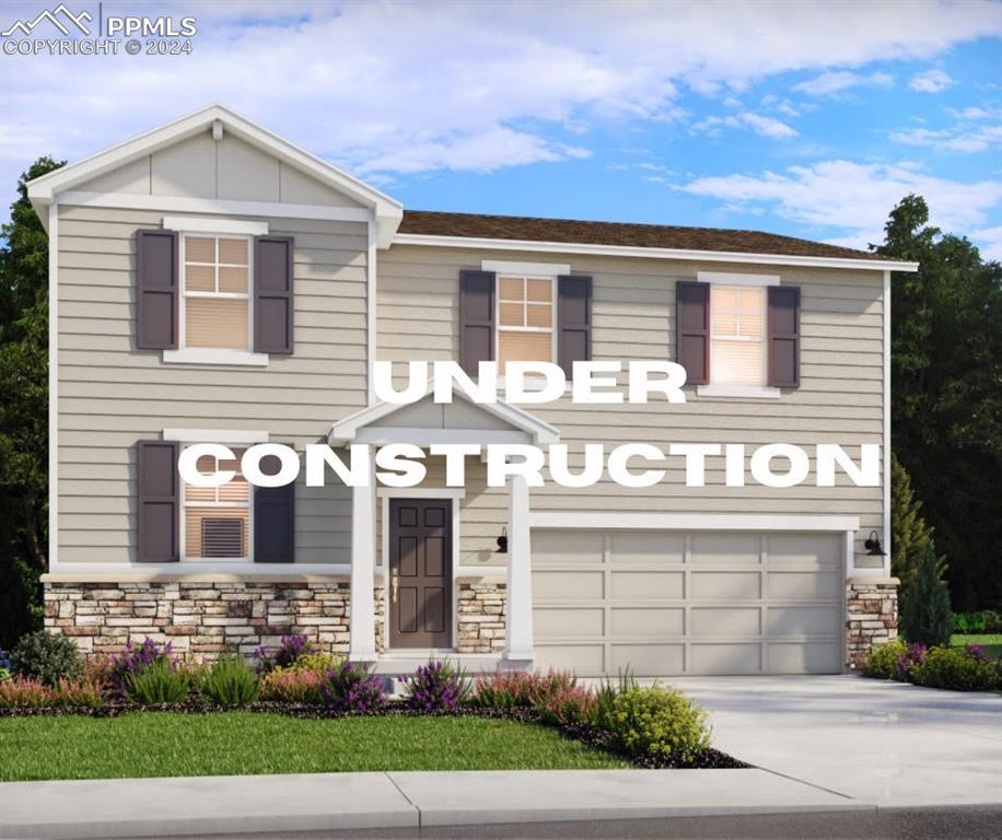 View of front of home featuring a garage