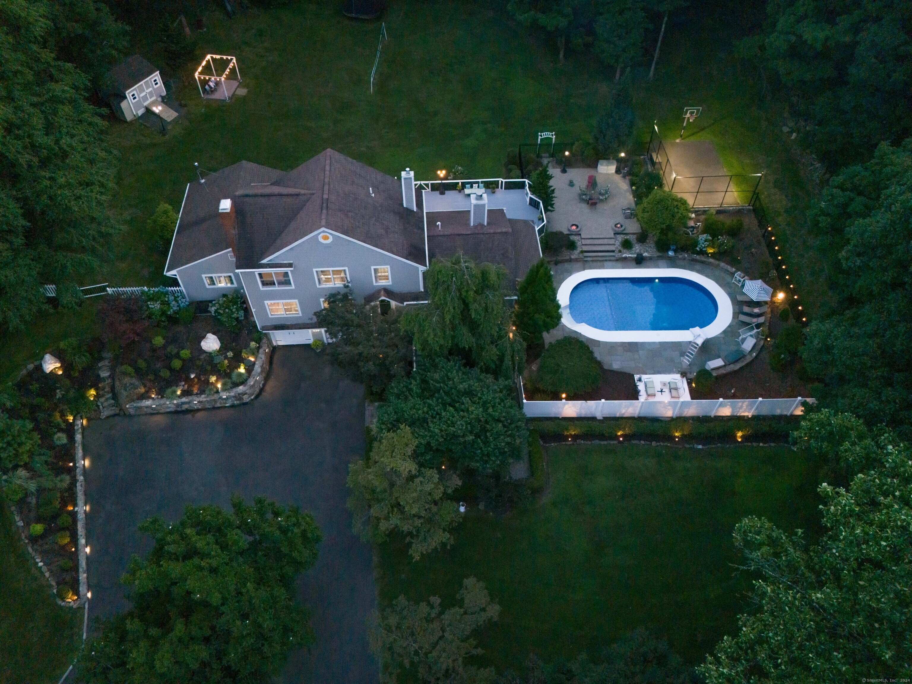 a aerial view of a house with garden space and street view