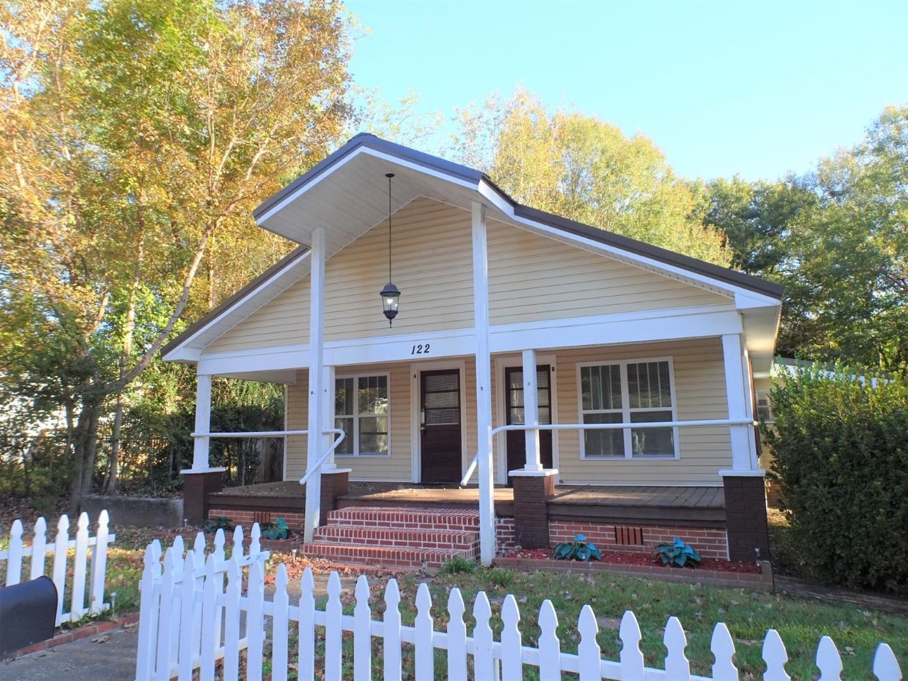 a front view of a house with porch