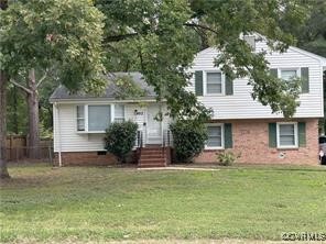 front view of house with a yard