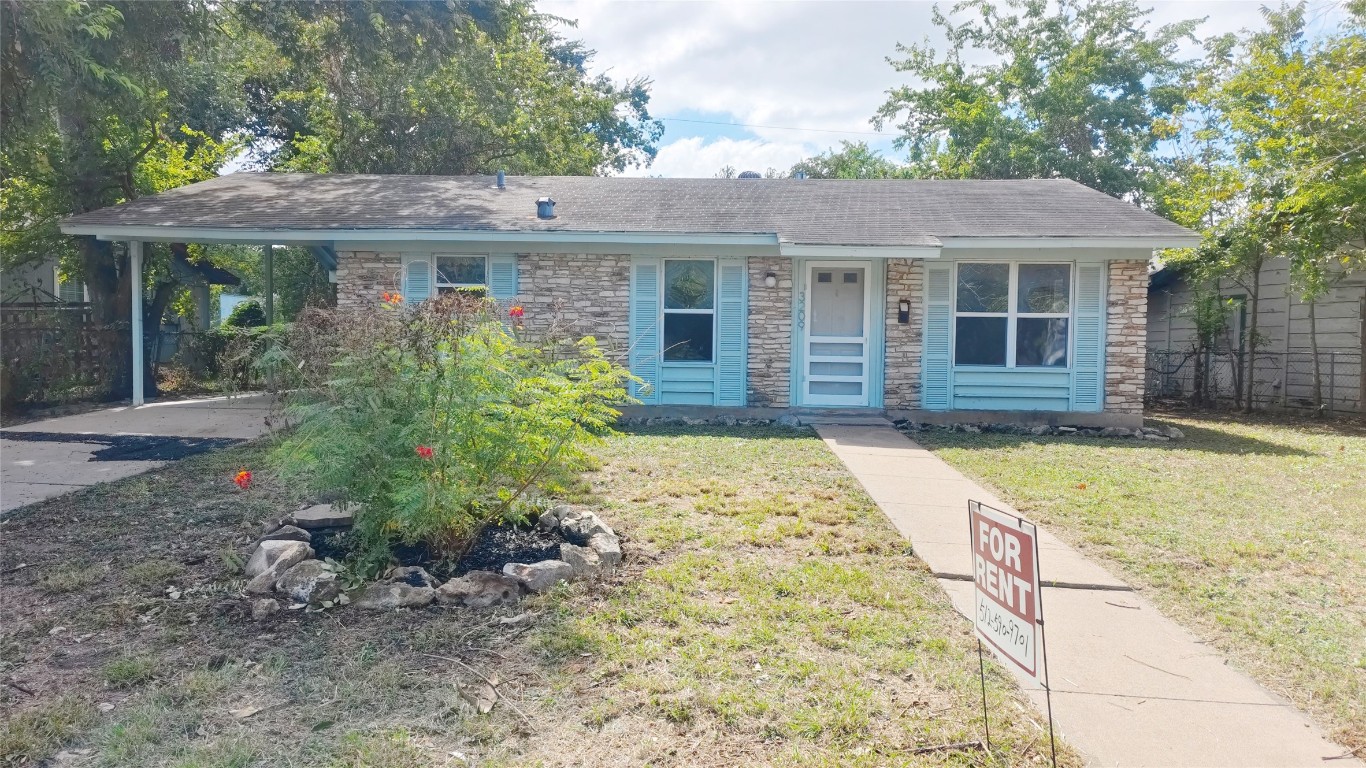 front view of a house with a yard