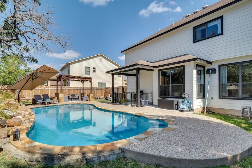 a view of a house with outdoor kitchen