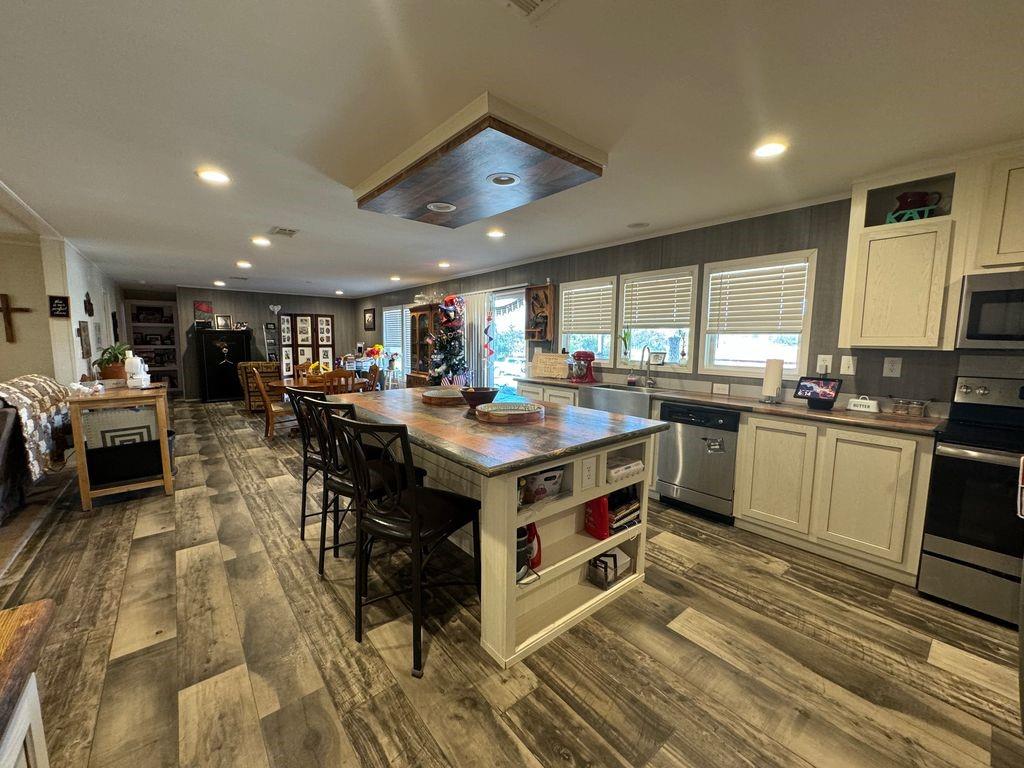 a kitchen with a stove a refrigerator and a counter space