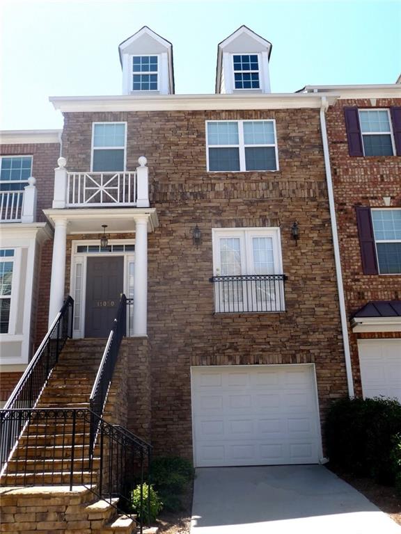 a front view of a house with many windows