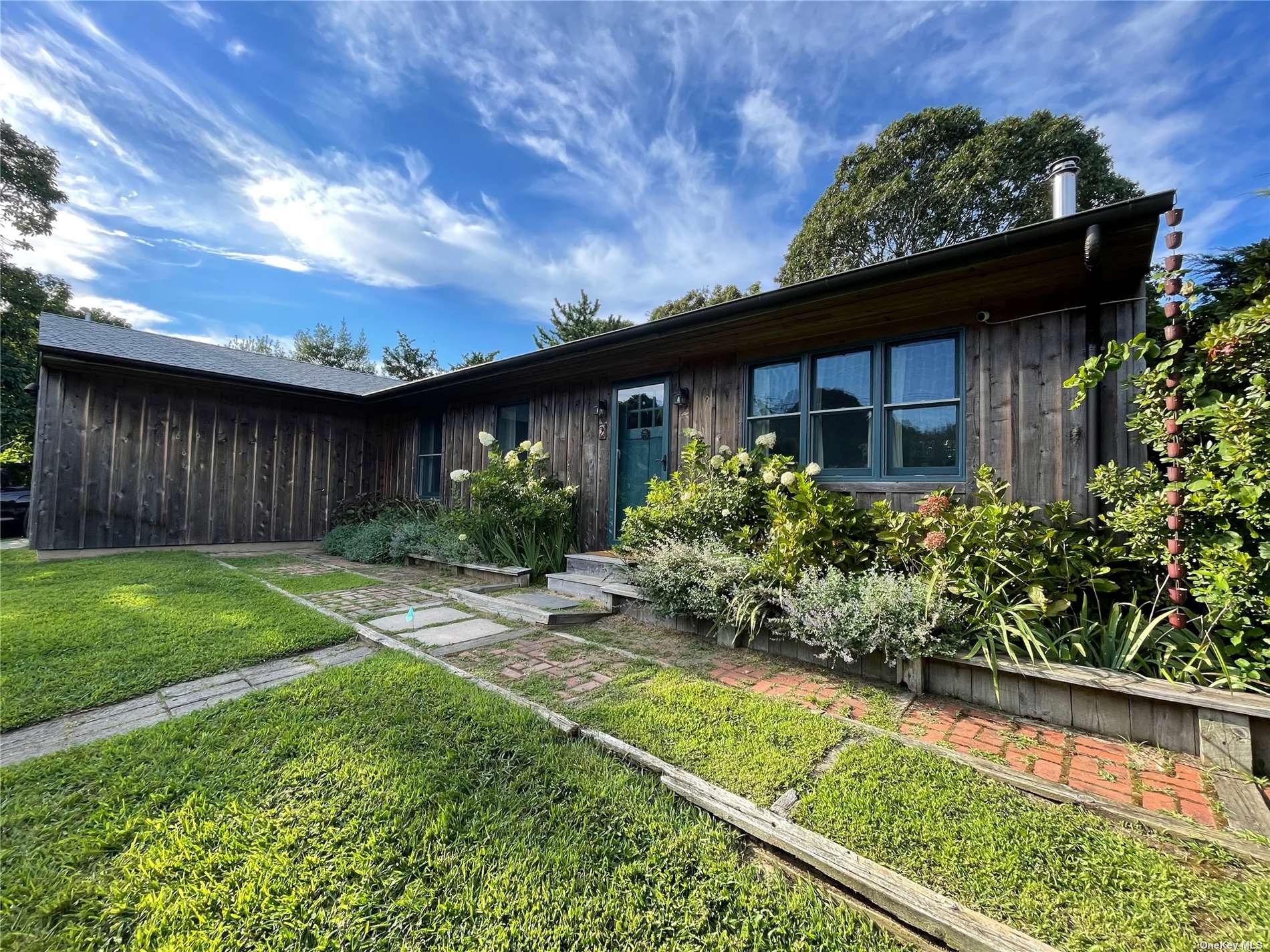 a backyard of a house with lots of green space